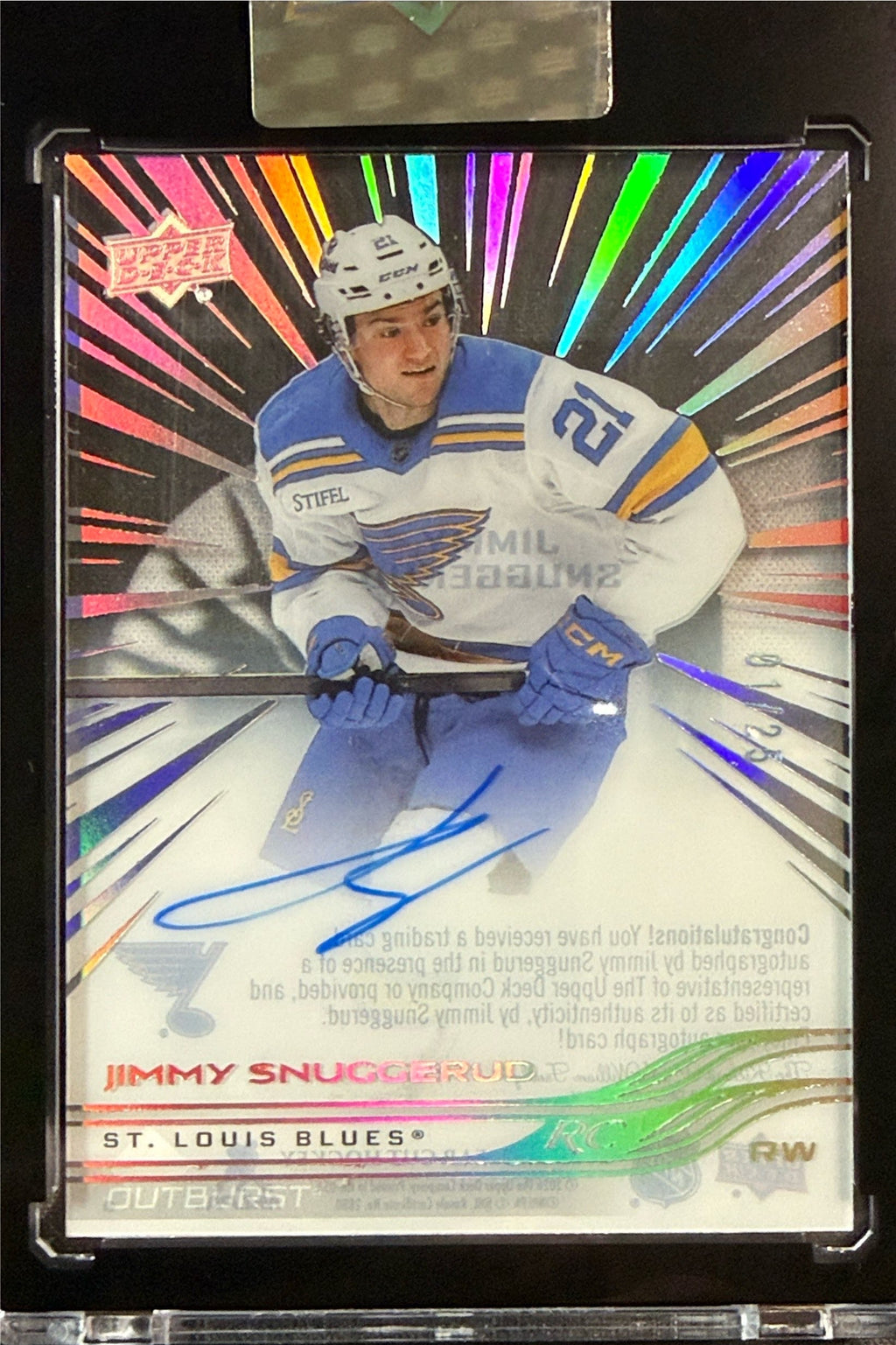 Jimmy Snuggerud Outburst autograph 01/25 in encased holder beside 2025-26 Clear Cut packaging