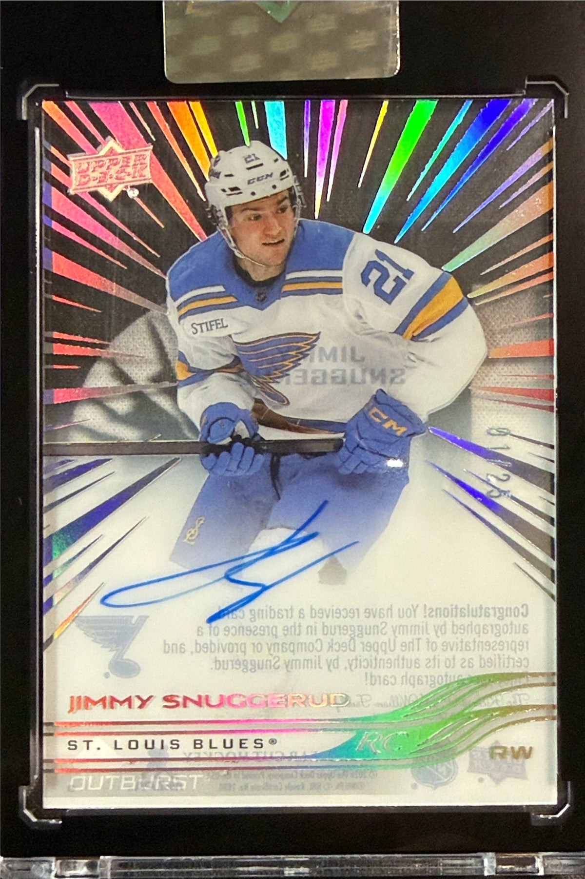 Jimmy Snuggerud Outburst autograph 01/25 in encased holder beside 2025-26 Clear Cut packaging